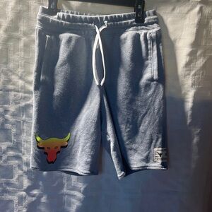Boys, under armor jogging shorts with drawstring. Size large, gray loose fit.